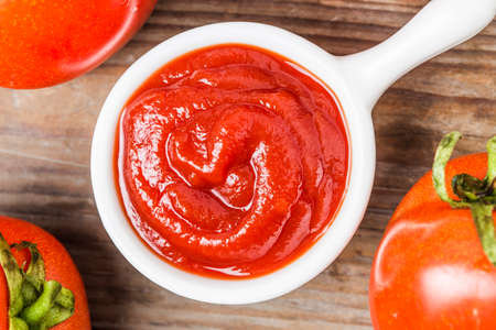 Wooden table tomato sauce