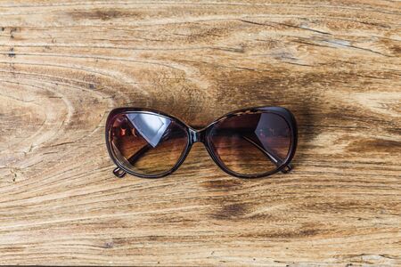 Glasses on wooden background
