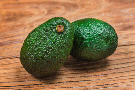 avocado on a dark wood background.