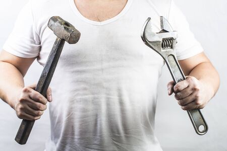 Man holding an adjustable wrenchの写真素材