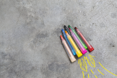 Back to school concept - rocket made from pencils, crayons and chalks