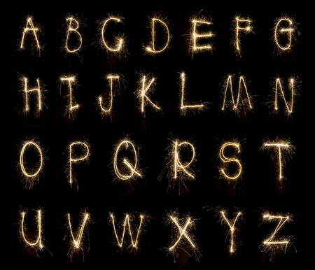 Alphabet sparklers on black backgroundの写真素材