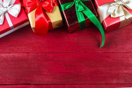 Christmas background with a red ornament, gift box.の写真素材