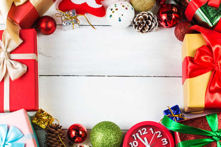 Christmas background with decorations and gift boxes on wooden boardの写真素材