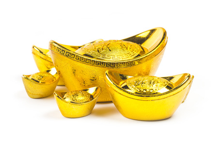 Chinese new year ornament.Decoration of chinese gold ingots in isolated white background with copy space.Chinese text language means blessing "Wealthy and good luck"の写真素材