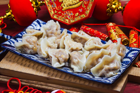 Chinese Jiaozi new year food, spring festival food on traditional spring festival Spring festival atmosphere and dumplingsの写真素材