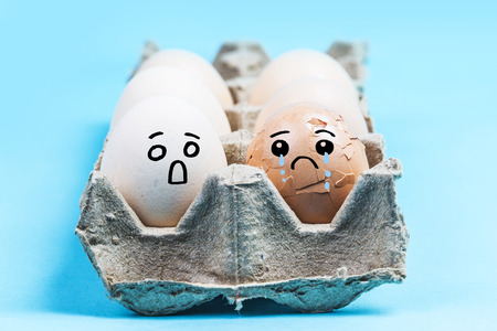 Egg with expression on blue backgroundの写真素材