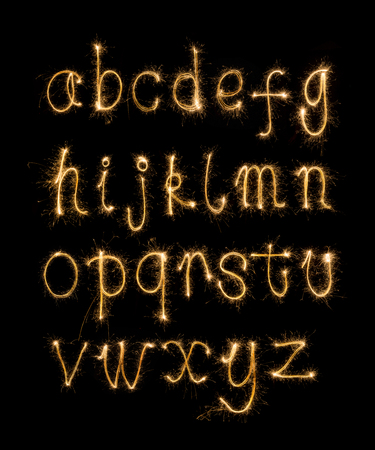 Alphabet sparklers on black backgroundの写真素材