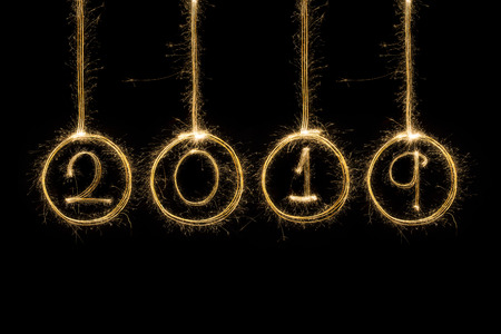 2019 written with Sparkle fireworks isolated on black backgroundの写真素材