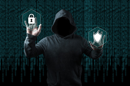 Anonymous computer hacker over abstract digital background. Obscured dark face in mask and hood....
