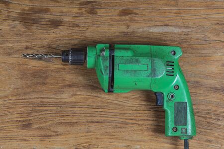 electric drill on wooden boardの写真素材