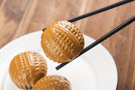 Traditional southern China brown bun filled with walnut cream