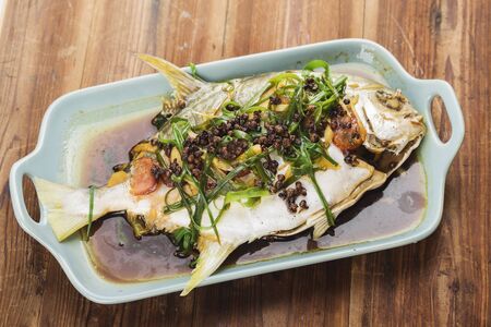 Steamed Gold pomfret, steamed fish with peppercornsの写真素材
