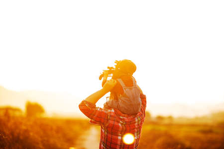 Child pilot aviator with airplane dreams of traveling in summer in nature at sunsetï¼ŒHappy kid...