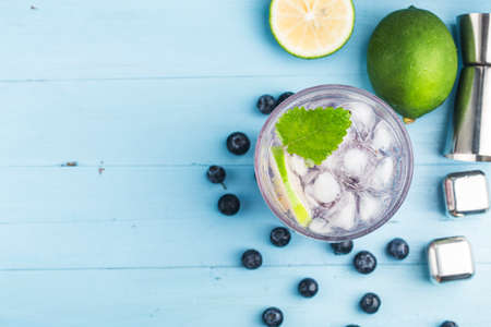 Summer refreshment drinks, Blueberry Lemonade or mojito cocktail with lemon, fresh blueberries and mint, の写真素材
