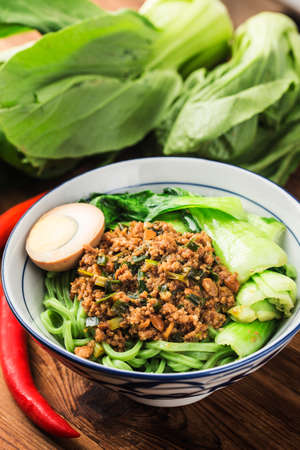 Traditional Chinese cuisine: spinach noodlesの写真素材