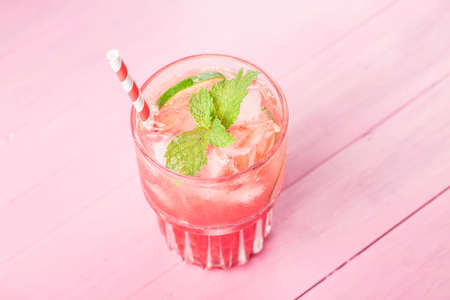Watermelon summer cocktail with ice and mint leaves.の写真素材