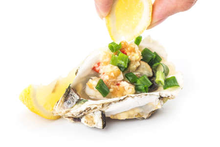 Grilled oysters with lemon garlicの写真素材
