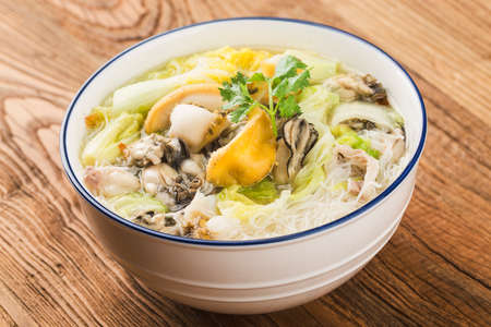 A bowl of abalone oyster rice noodlesの写真素材