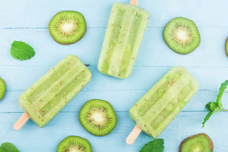 Kiwi ice cream on top of wooden board backgroundの写真素材