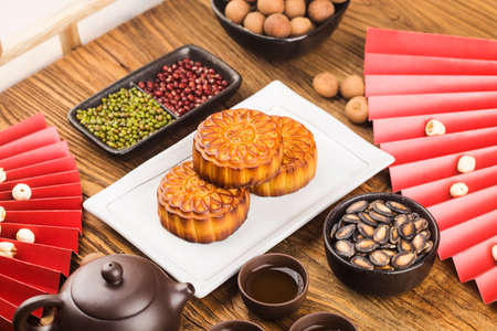 Mid-Autumn Festival concept, Traditional mooncakes on table with teacup.