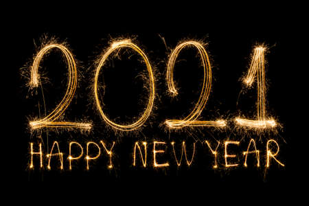 Happy New Year 2021. Sparkling burning text Happy New Year 2021 isolated on black background.の写真素材