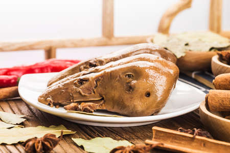 Delicious spiced duck head on a plate