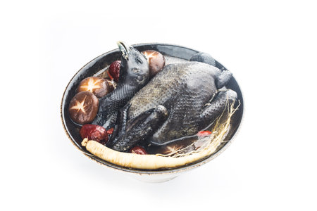 Ginsengs and black chicken soup, food as medicine.の写真素材