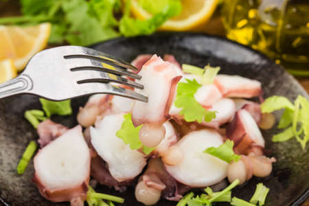 A plate of fresh sliced squid whiskersの写真素材