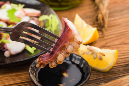 A plate of fresh sliced squid whiskersの写真素材