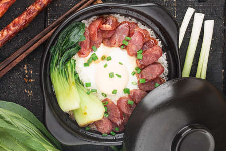 Cantonese style cooking of claypot rice with waxed meatsの写真素材