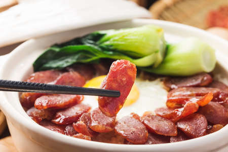 Cantonese style cooking of claypot rice with waxed meatsの写真素材