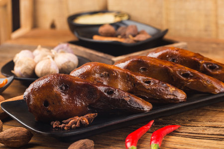 Delicious spiced duck head on a plateの写真素材