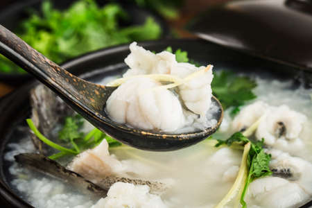 Chinese cuisine; Congee with fish slices in casseroleの写真素材
