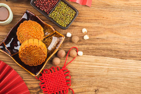 Mid-Autumn Festival concept, Traditional mooncakes on table with teacup.