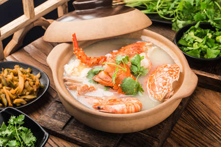 Lobster Seafood congee in casseroleの写真素材