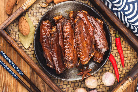 The duck's wings were boiled and placed on a plate