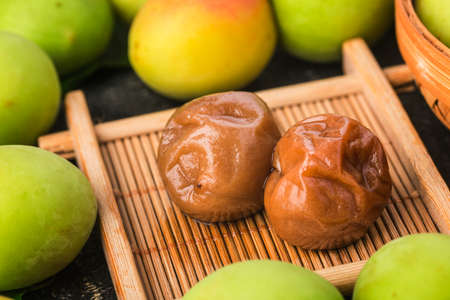 Fresh green plum and preserved green plumの写真素材