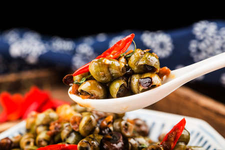 Chinese food: Stir fried snails with thirteen spicesの写真素材