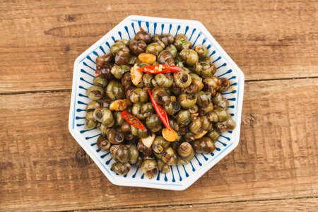 Chinese food: Stir fried snails with thirteen spicesの写真素材