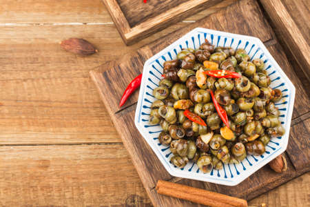 Chinese food: Stir fried snails with thirteen spicesの写真素材