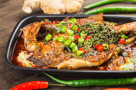 Chinese Cuisine: a plate of spicy roast fishの写真素材