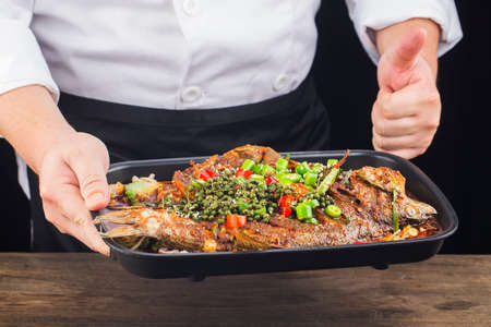 Chinese Cuisine: a plate of spicy roast fishの写真素材