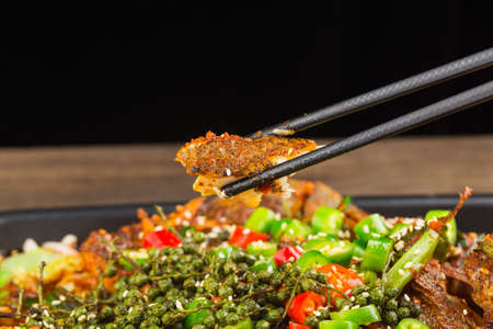 Chinese Cuisine: a plate of spicy roast fishの写真素材