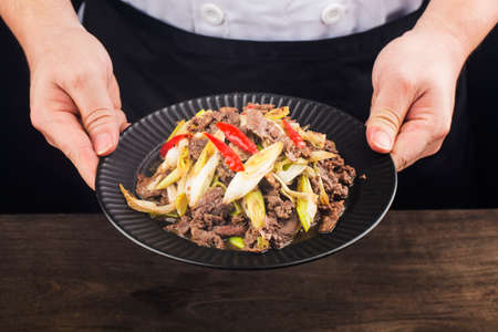 Chinese food: a plate of beef with scallionsの写真素材