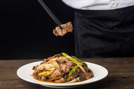 Chinese food: a plate of beef with scallionsの写真素材