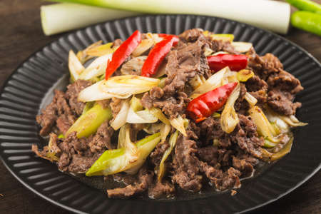 Chinese food: a plate of beef with scallionsの写真素材