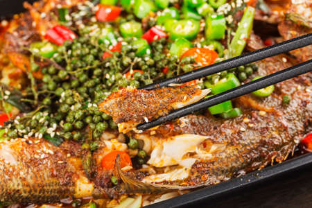 Chinese Cuisine: a plate of spicy roast fishの写真素材