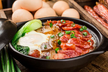 Cantonese style cooking of claypot rice with waxed meatsの写真素材