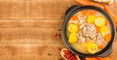 Stewed mutton soup with corn and carrotの写真素材
